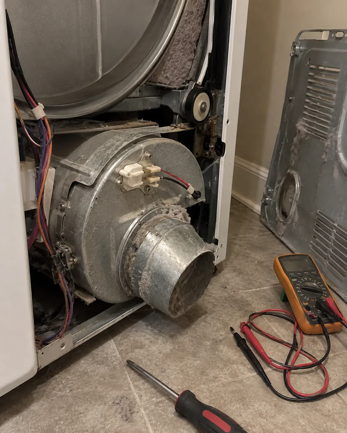 Dryer heating and exhaust components exposed for inspection