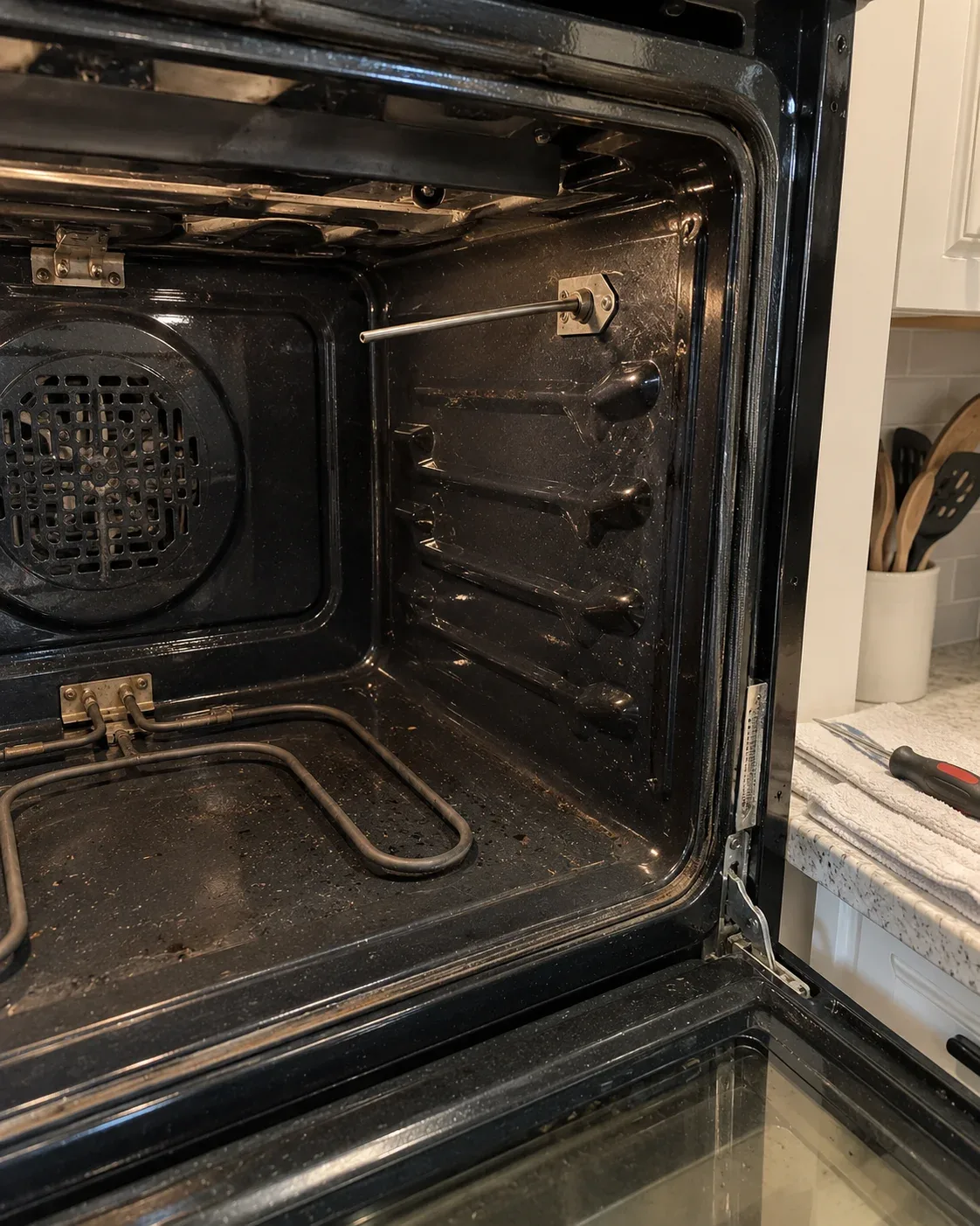 Electric oven temperature sensor and bake heating element